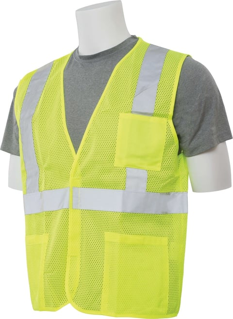 High-visibility safety vest in neon yellow with reflective silver stripes, worn over gray t-shirt on mannequin